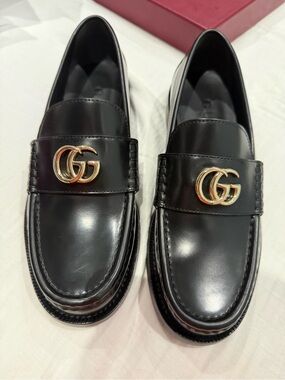 Gucci women Black Leather GG Logo Penny Loafers